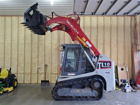 takeuchi skid steer bucket release|takeuchi 3 point attachments.